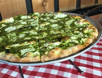 Pizza with pesto sauce